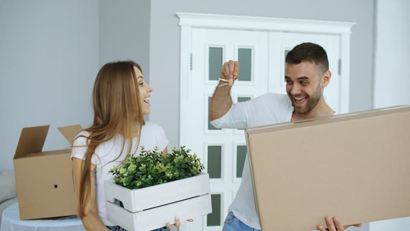 Couple happily moving into their new home